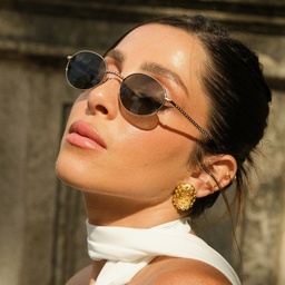 Shop TRICE Mila Chain Oval Sunglasses in Gold online.