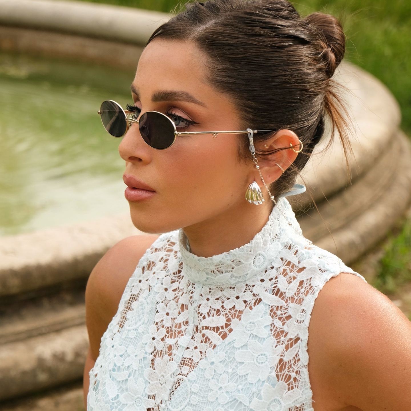 Shop TRICE Mila Chain Oval Sunglasses in Light Gold online.