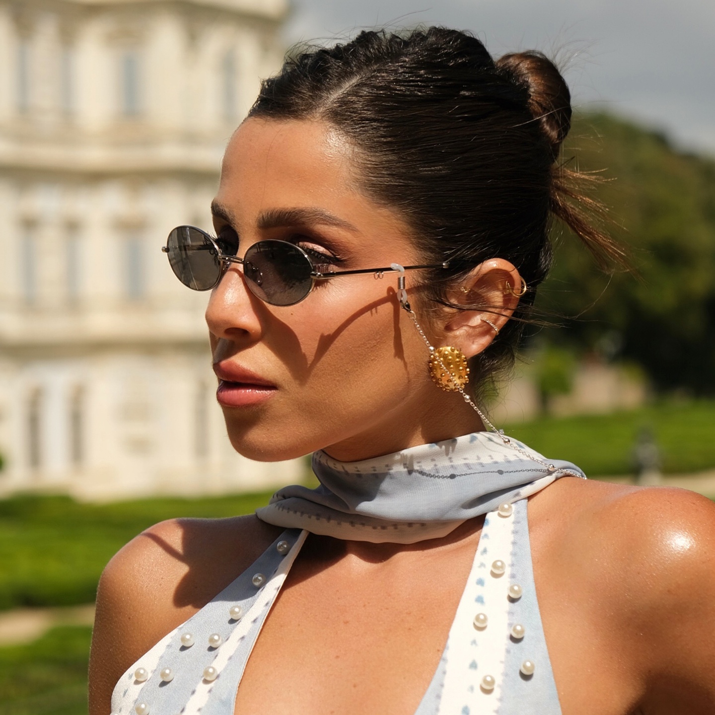 Shop TRICE Mila Chain Oval Sunglasses in Silver online.